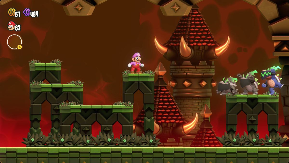 Super Mario Bros. Wonder Mario fighting Bowser Jr. in the Deep Magma Bog Palace.